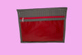 Red pouch with black polka dots and a black and white striped top on a white background