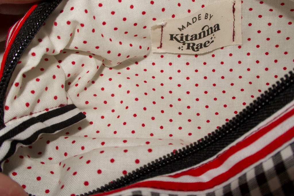 Polka dot bag with 'Made by Kitanma Rae' label