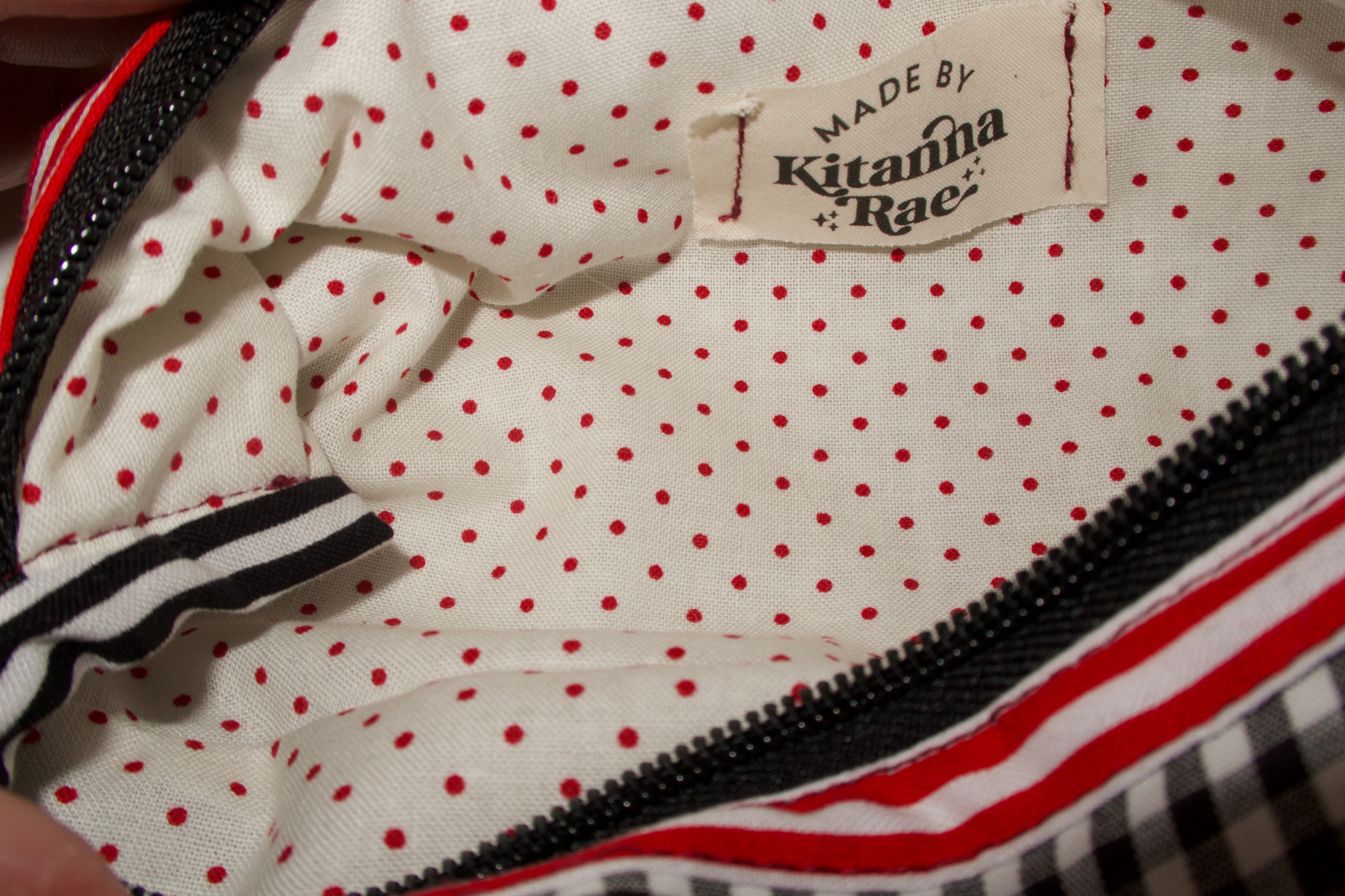 Polka dot bag with 'Made by Kitanma Rae' label