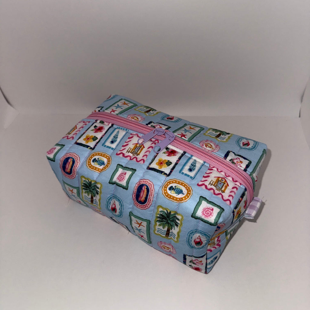 Rectangular pouch with colorful pattern on a white background