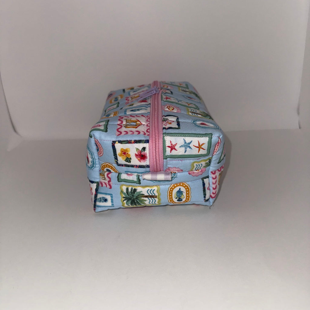 Colorful fabric pouch with zipper on a white background